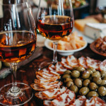 Sampling Andalusian sherry wines with Spanish tapas olives and cheeses